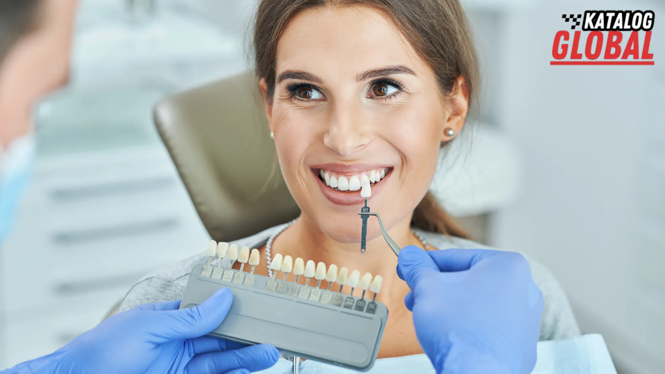 "Smiling patient getting shade matched during teeth whitening consultation – How Long Does Teeth Whitening Last"