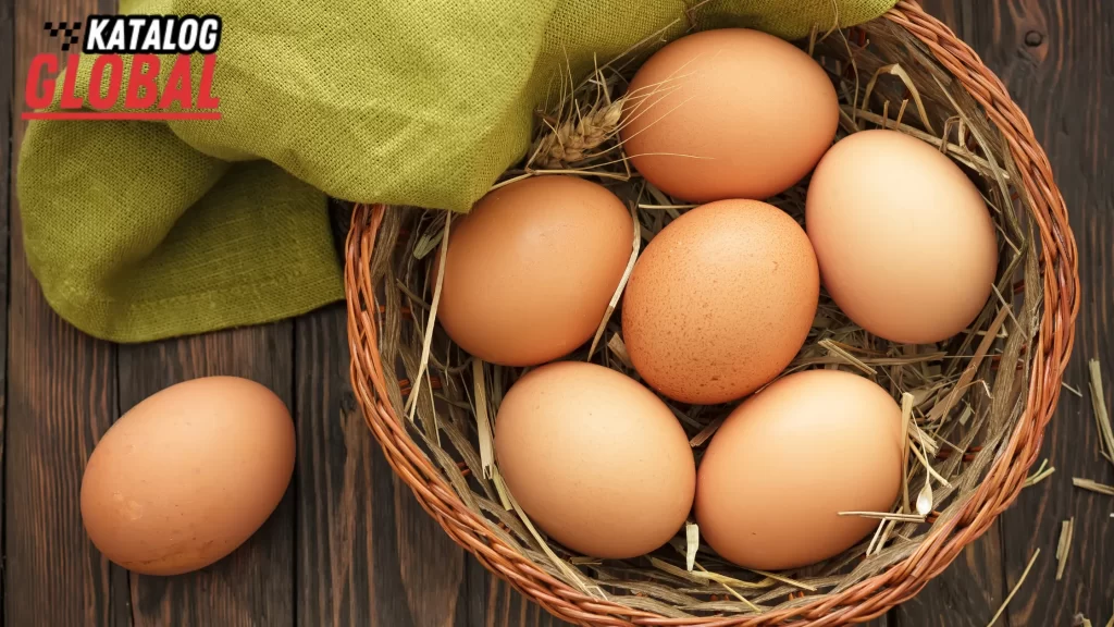 How Long Do Farm Fresh Eggs Last in a basket with hay on a wooden surface